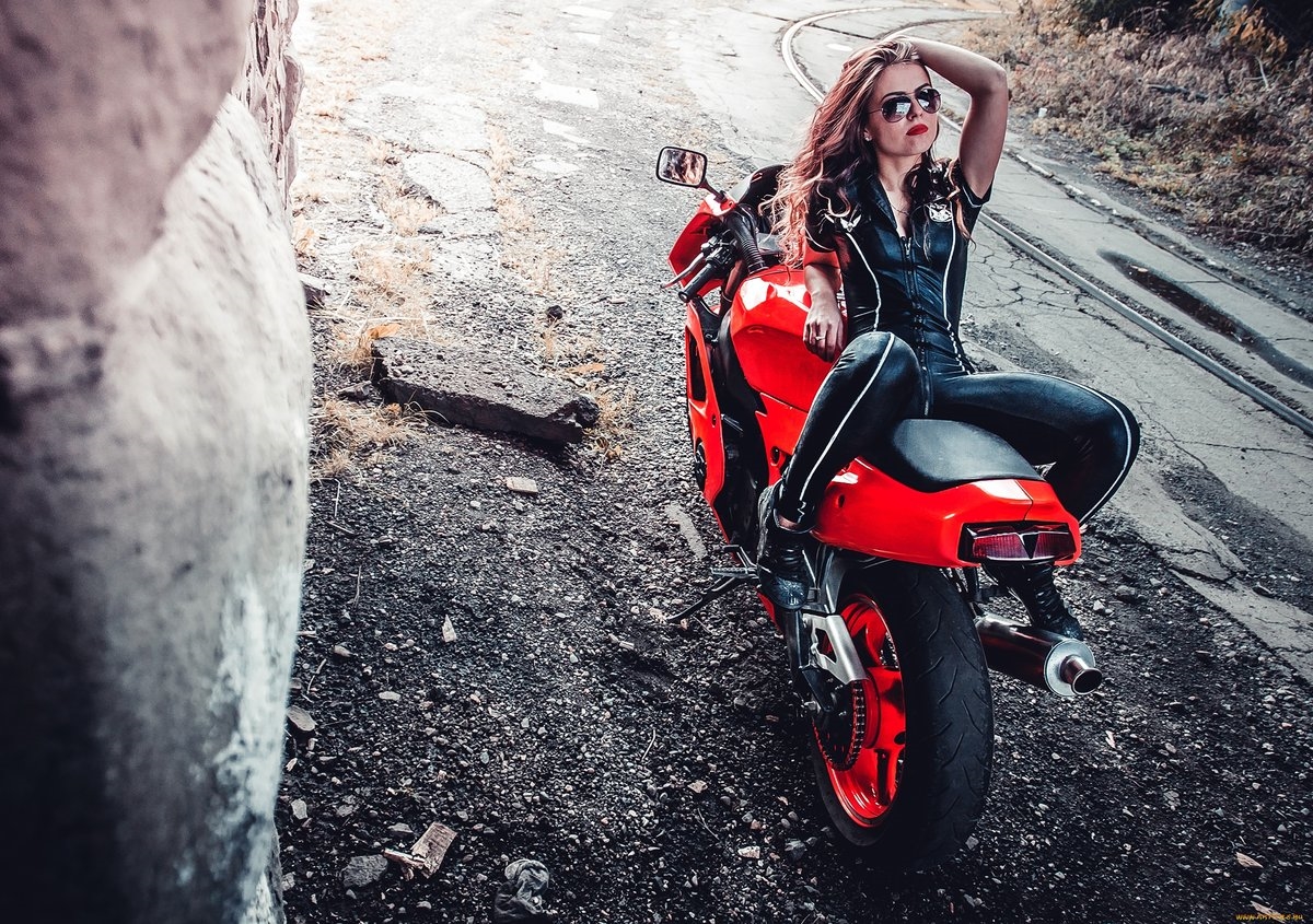 Blondes on a motorcycle in Genoa